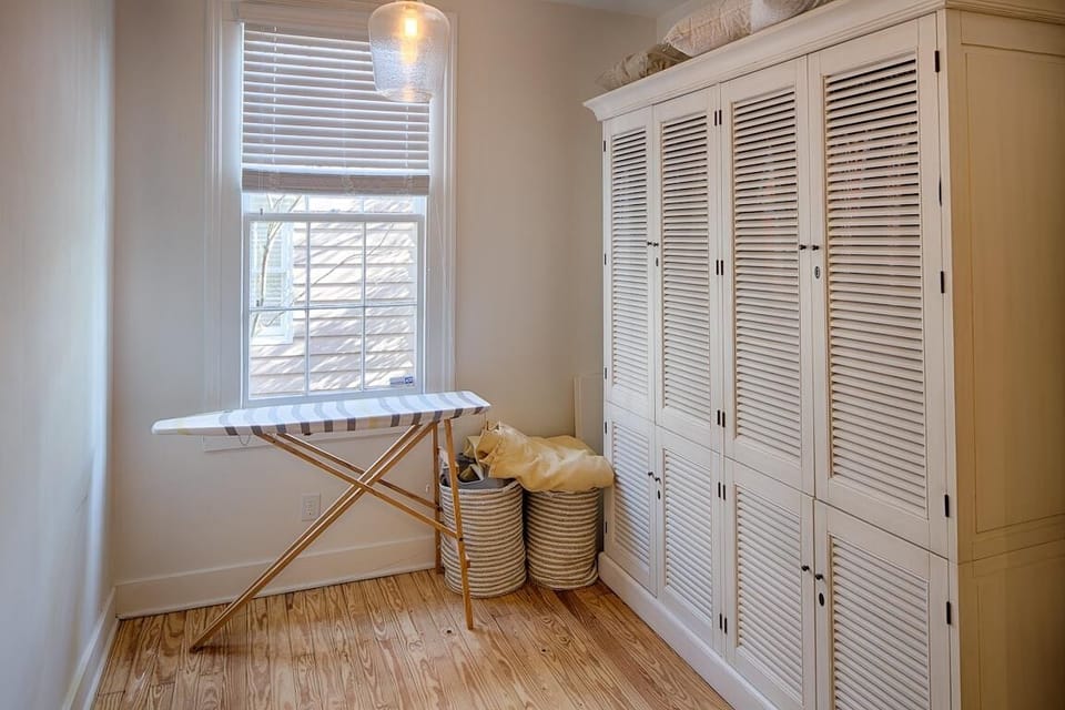 Feel at home with this large closet and ironing area.