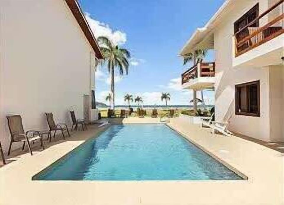 Plunge into the refreshing community pool, just steps from the beach.