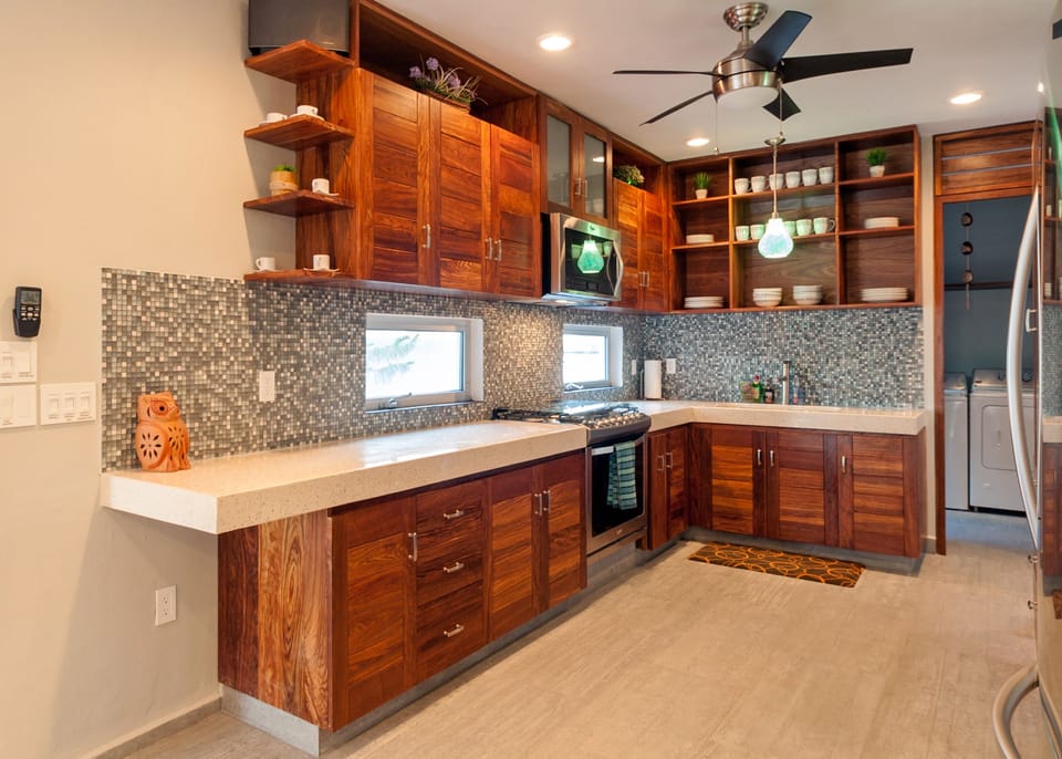 Everything you'd expect in an upscale kitchen - Wooden cabinets and beautiful tiles make the kitchen as beautiful as it is convenient.