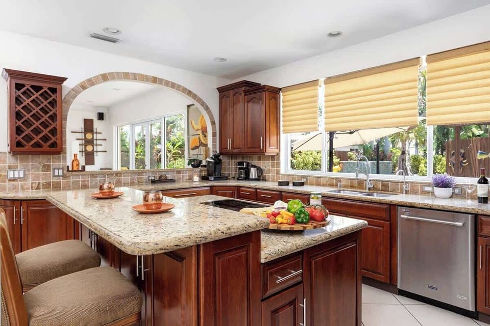 A kitchen counter with bar stools is perfect for entertaining.