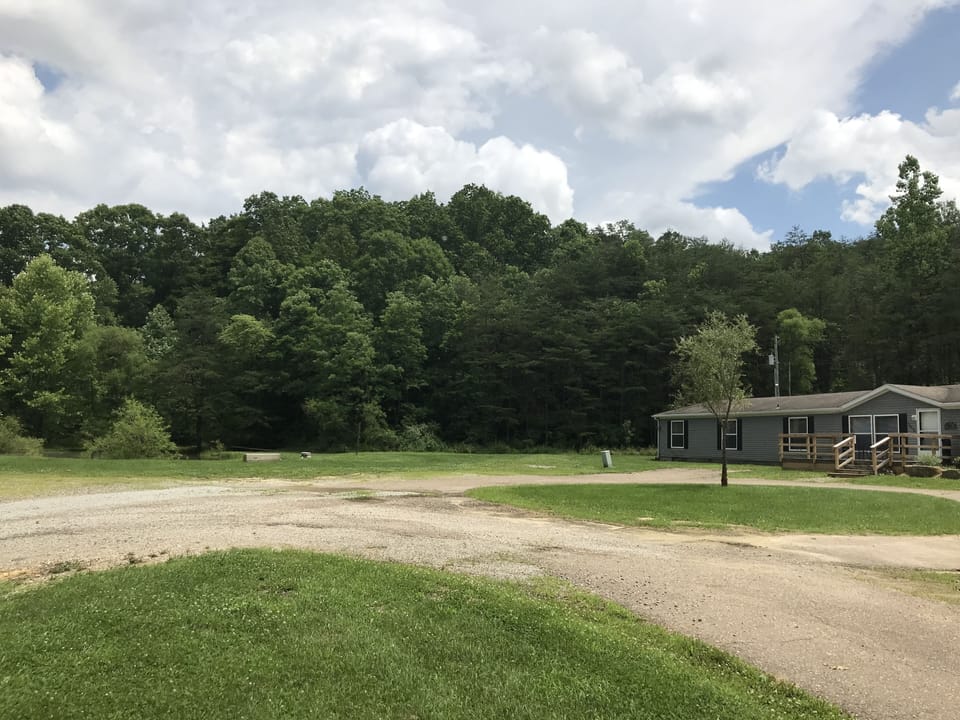 Pond sits right out from house with a large front yard and lots of parking 