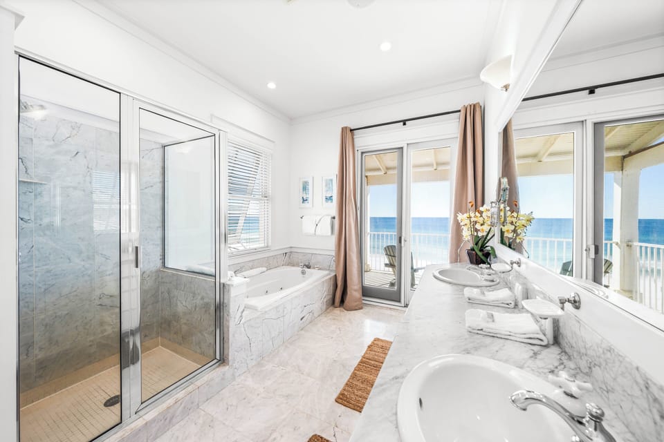 Walk-in shower, jetted tub, two sinks, marble vanity and one stunning view!   This is your primary ensuite bathroom on the 3rd floor