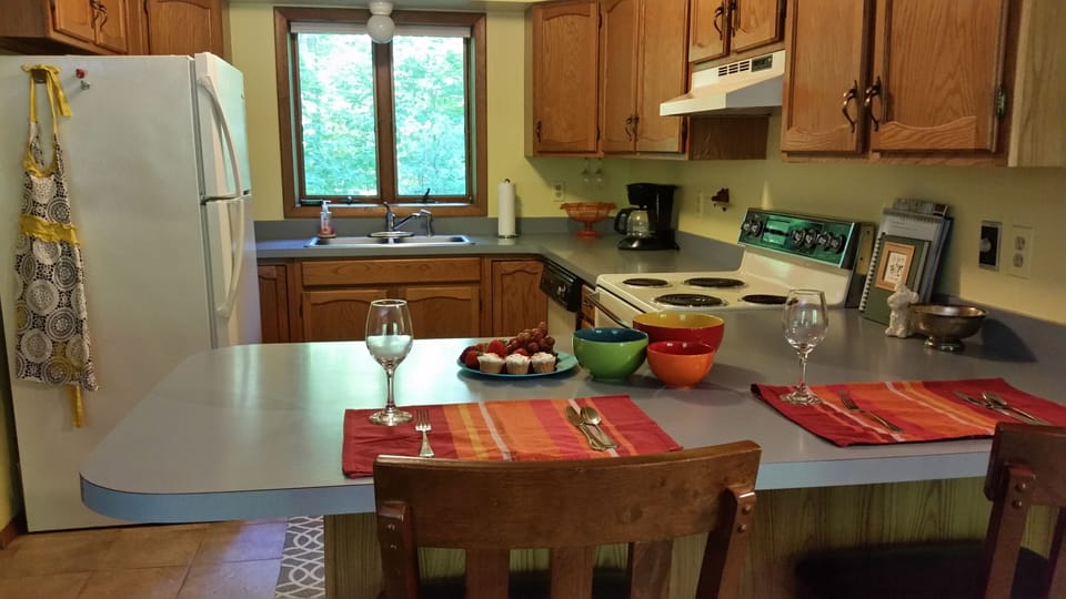 Full kitchen with coffee maker.