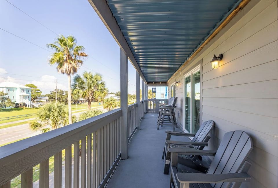 Private Balcony - The spacious, private balcony can be accessed from the living area and both bedrooms for convenience. Relax on polywood patio furniture while you sip morning coffee and watch sunrises over Little Lagoon.