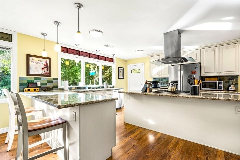 Well appointed kitchen granite tops and eating bar!