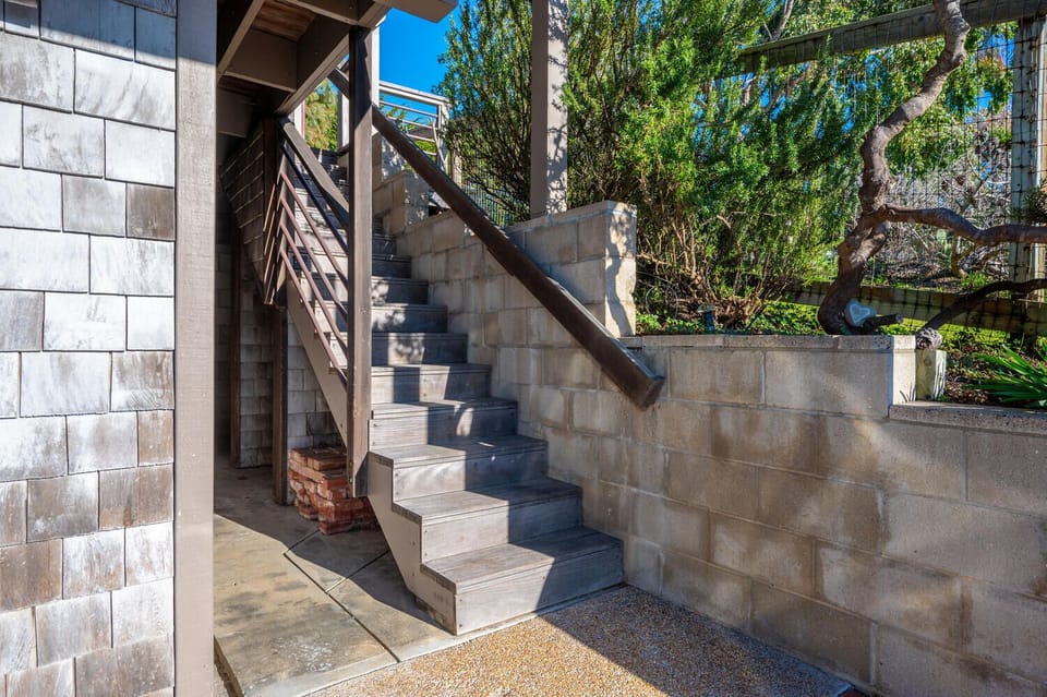 Stairs - The stairs leading to the front door.