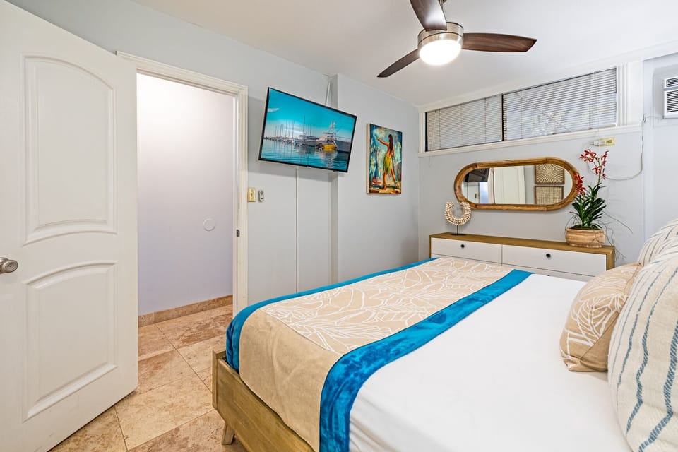 bedroom with AC and ceiling fan