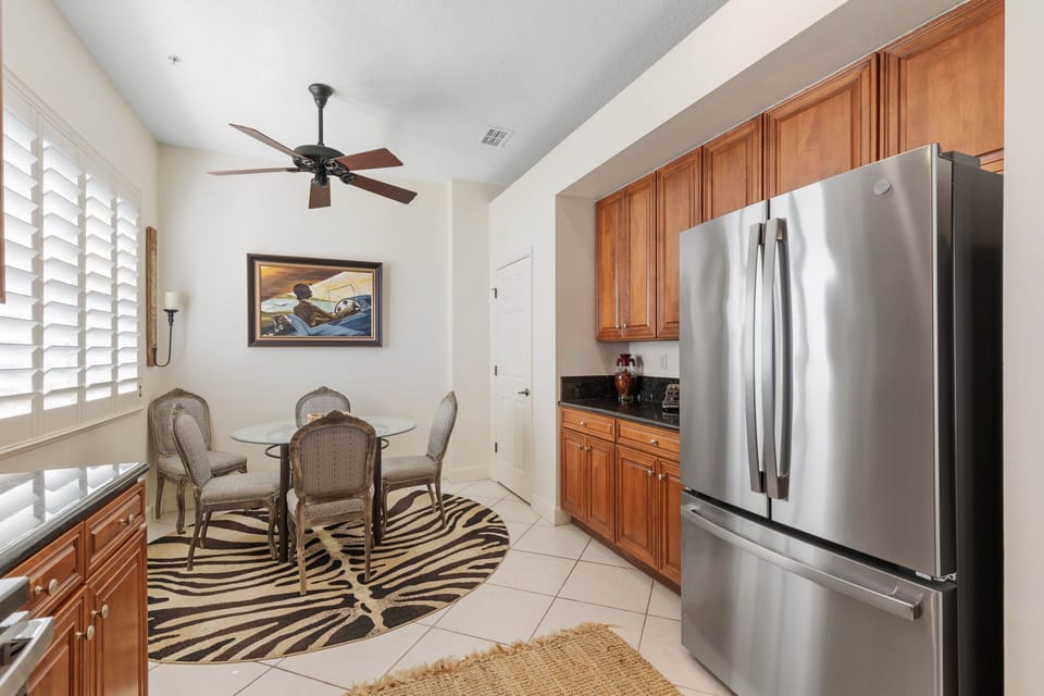 The kitchen includes stainless steel appliances.