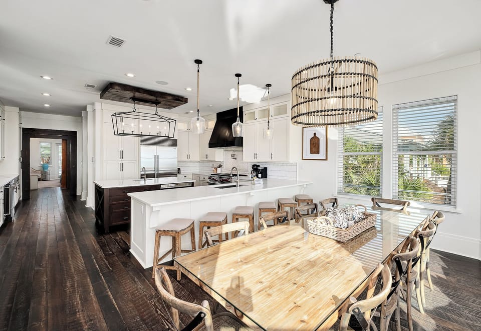 Your spacious kitchen flows seamlessly into the dining area, where you'll create memorable meals together beneath statement lighting and warm wood accents.