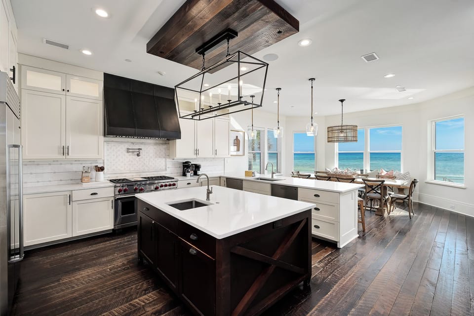 Your gourmet kitchen features premium appliances and stunning ocean views, perfect for cooking while watching the waves.