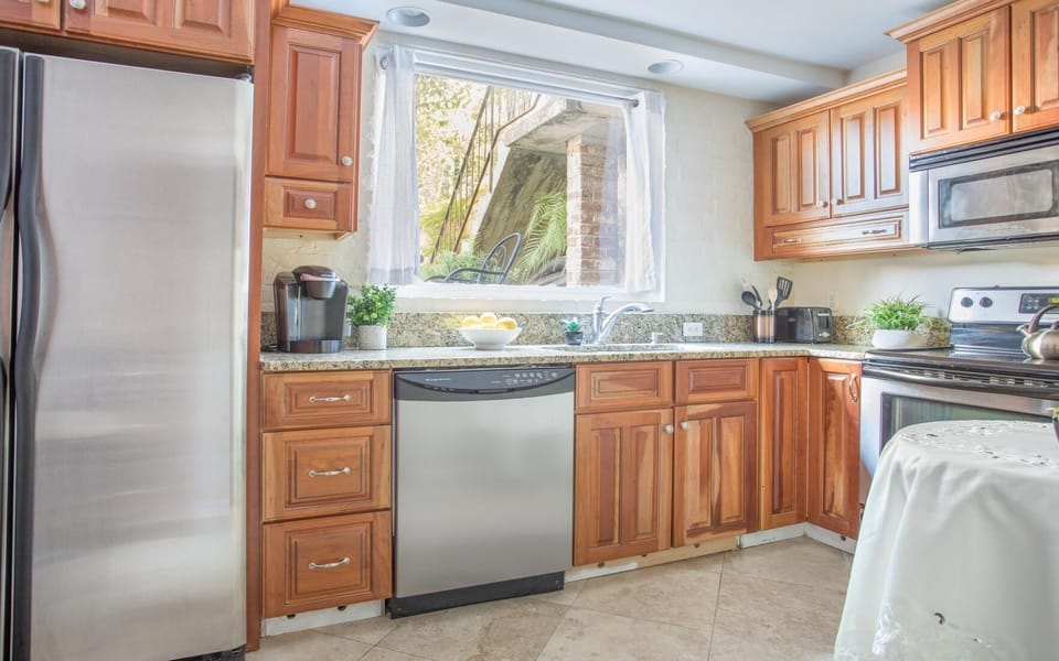 The bright and sunny kitchen is equipped with everything you'd need.