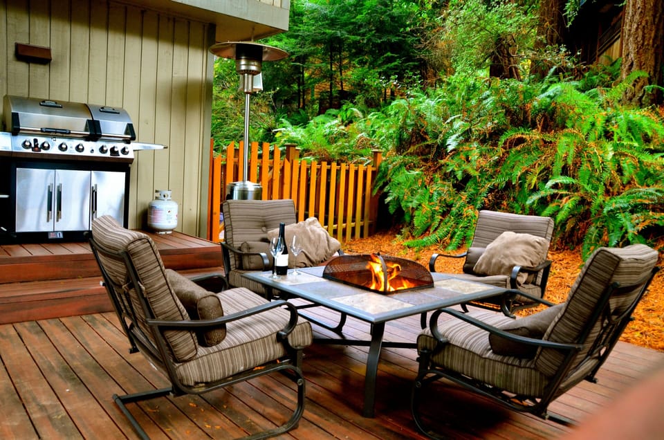 Comfortable furniture with fire pit and outdoor grill