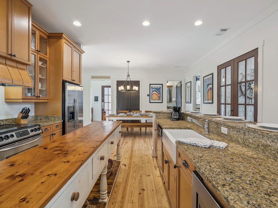 Your spacious kitchen awaits with granite counters, stainless appliances, and warm wood touches for memorable meal preparation.