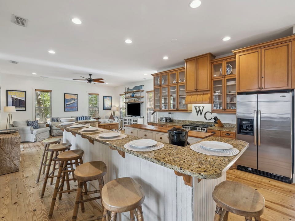 Your spacious kitchen island becomes the heart of gathering, with granite countertops perfect for morning coffee and evening conversations.