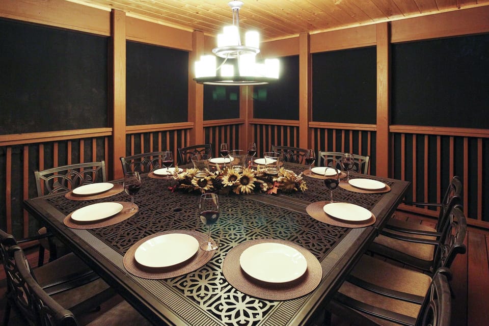 Outdoor dining in our screened in porch with a Propane Gas Grill just outside!