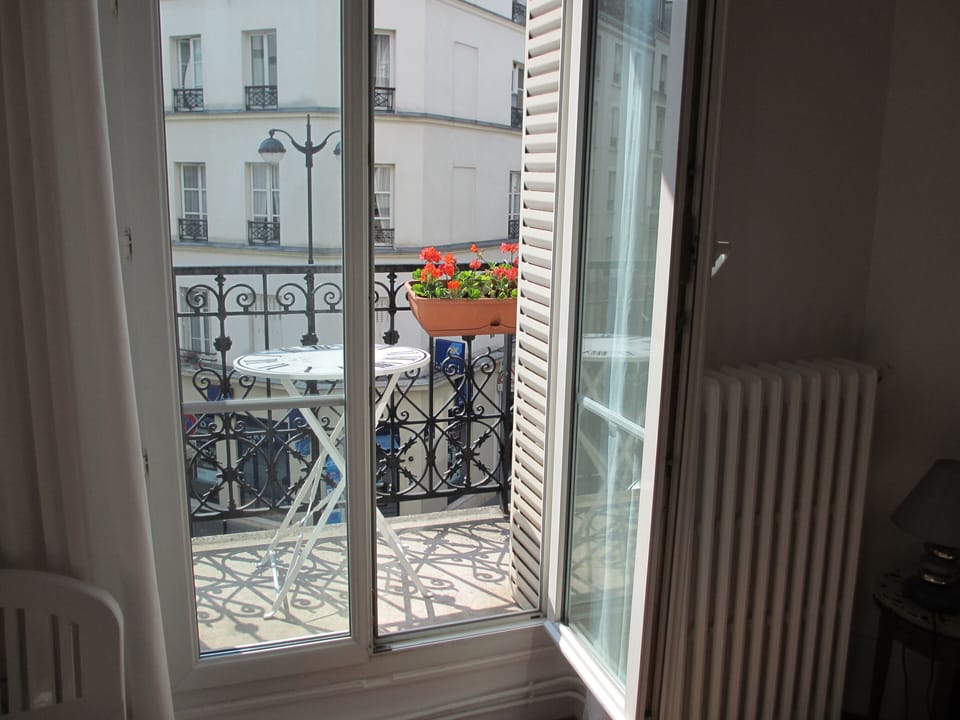 Floor to ceiling windows and sunny balcony