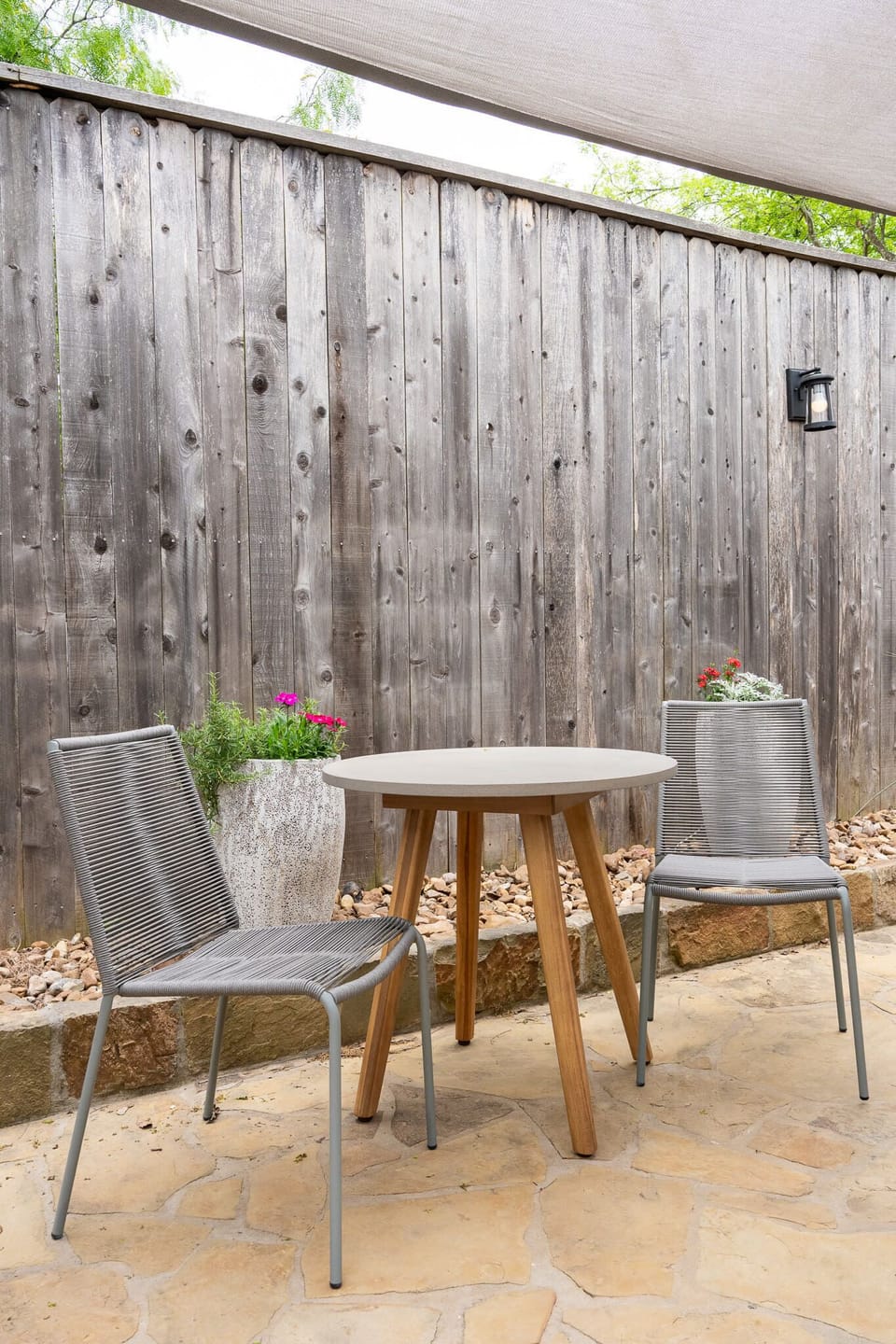 Outdoor Bistro Dining – Courtyard table for morning coffee.