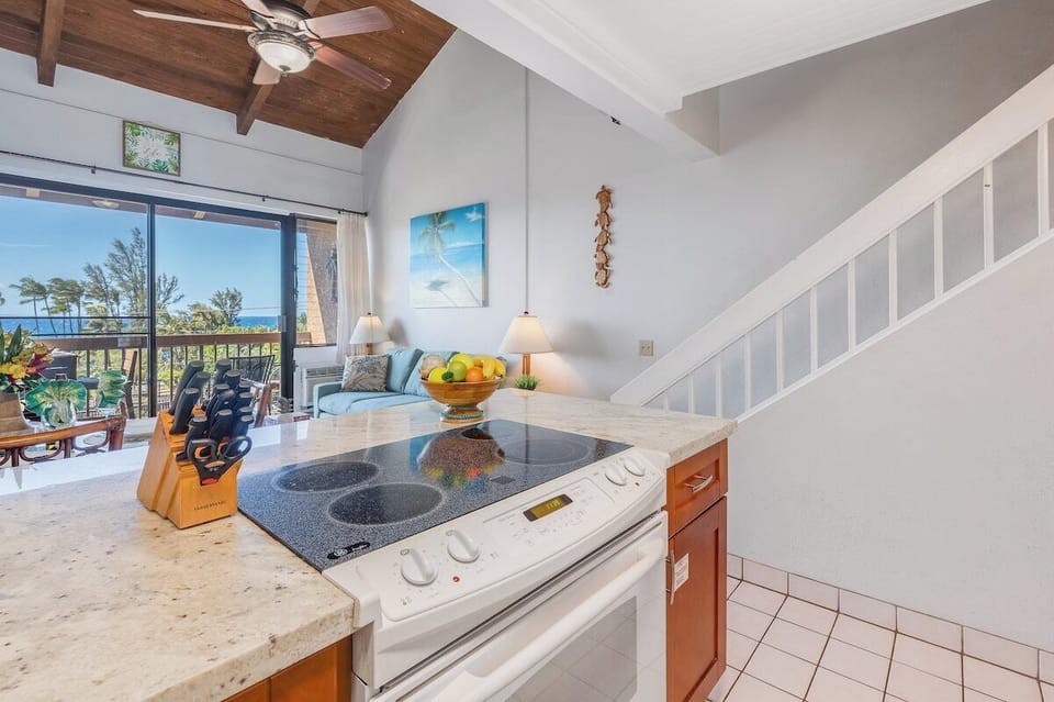 Prepare meals while staying connected with family in the adjoining living room and dining area