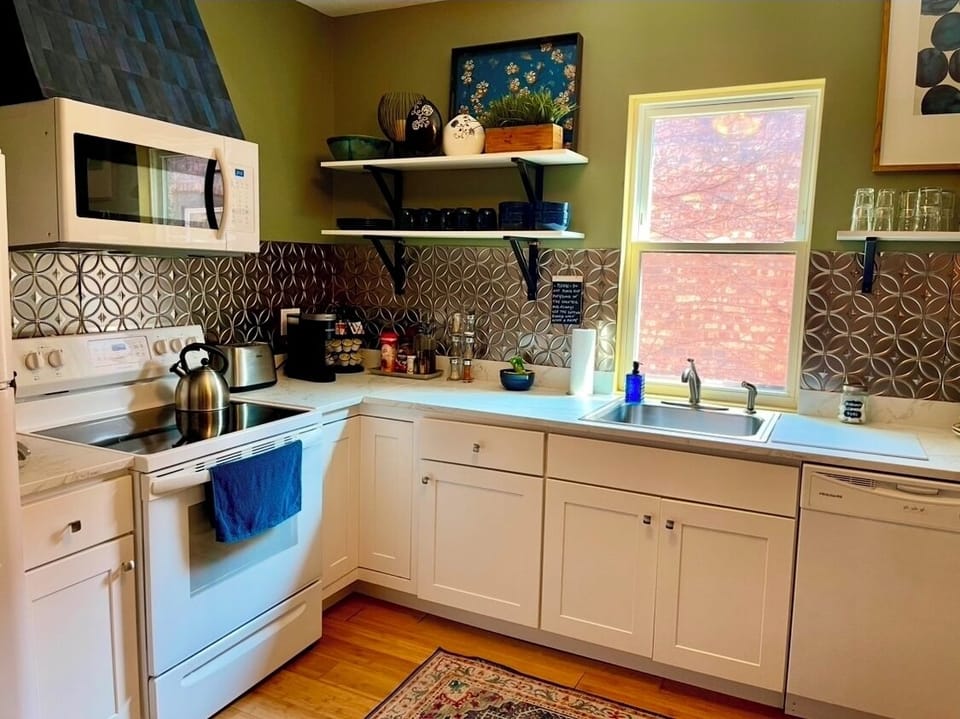 Large sunny kitchen equipped with all you need during your stay