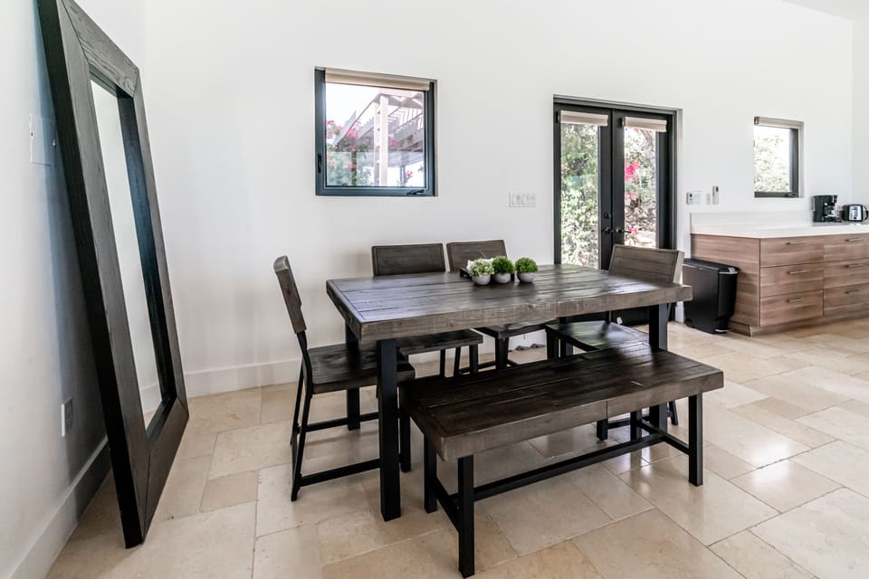 Dining area seating for 6 plus bar stools in kitchen gives you seating for 10