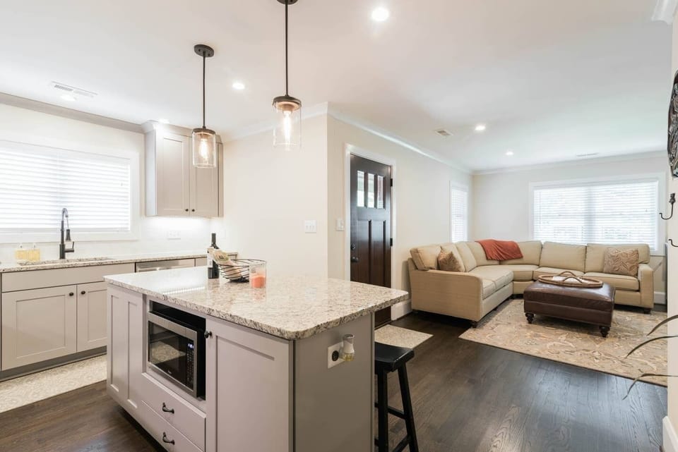 Custom Kitchen with Large Granite Island and Pendant Lighting