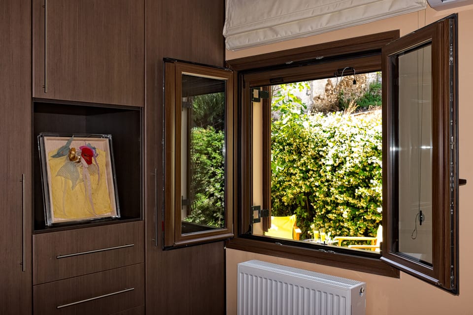 This bedroom has views of the blooming garden and easy access to it!!!!!