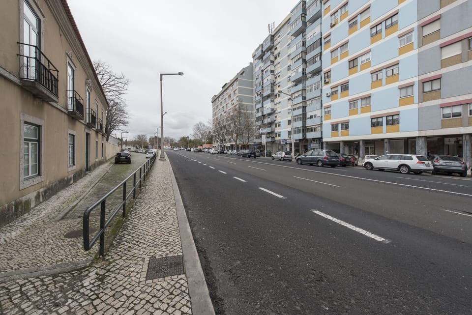 Street view and building facade. View of the public street parking.
