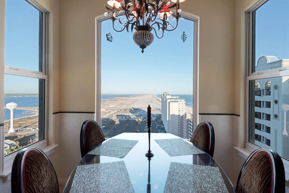 Breakfast room dining with custom made table & chairs and sound & gulf views