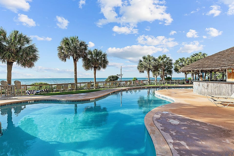 Sparkling oceanfront pools overlooked by the Sandpiper Tiki Bar, open for fresh food and poolside beverages daily in season