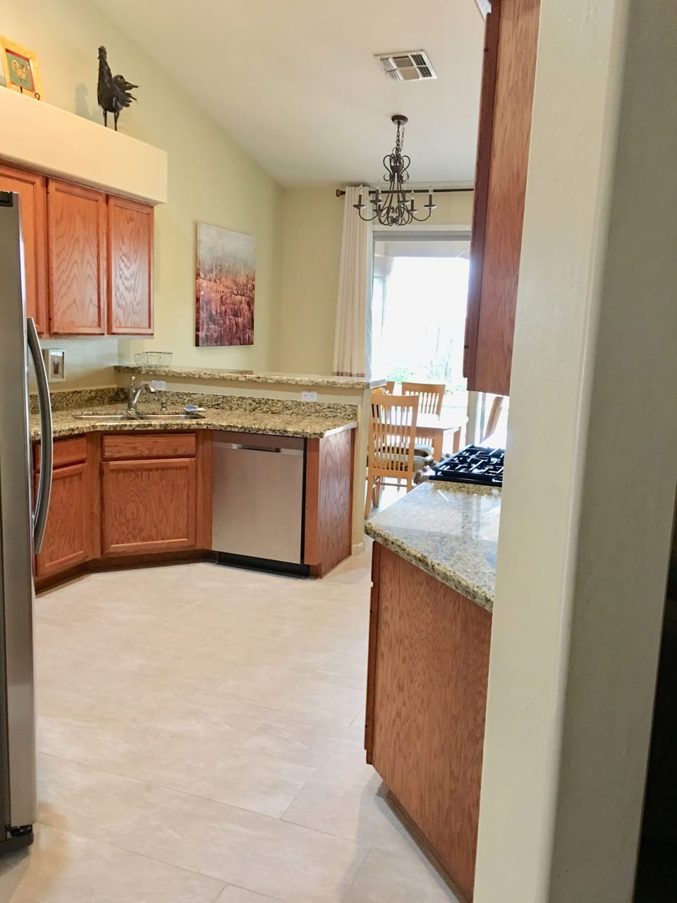 New floors and granite countertops in kitchen. 