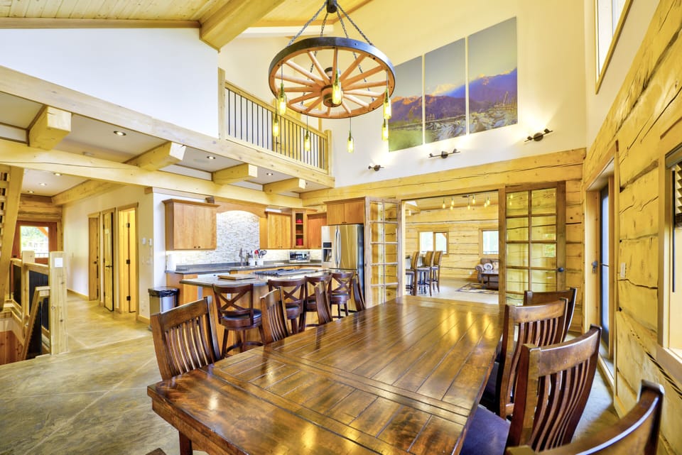 large dining area with table for 12 and an additional 4 seats at the counter and