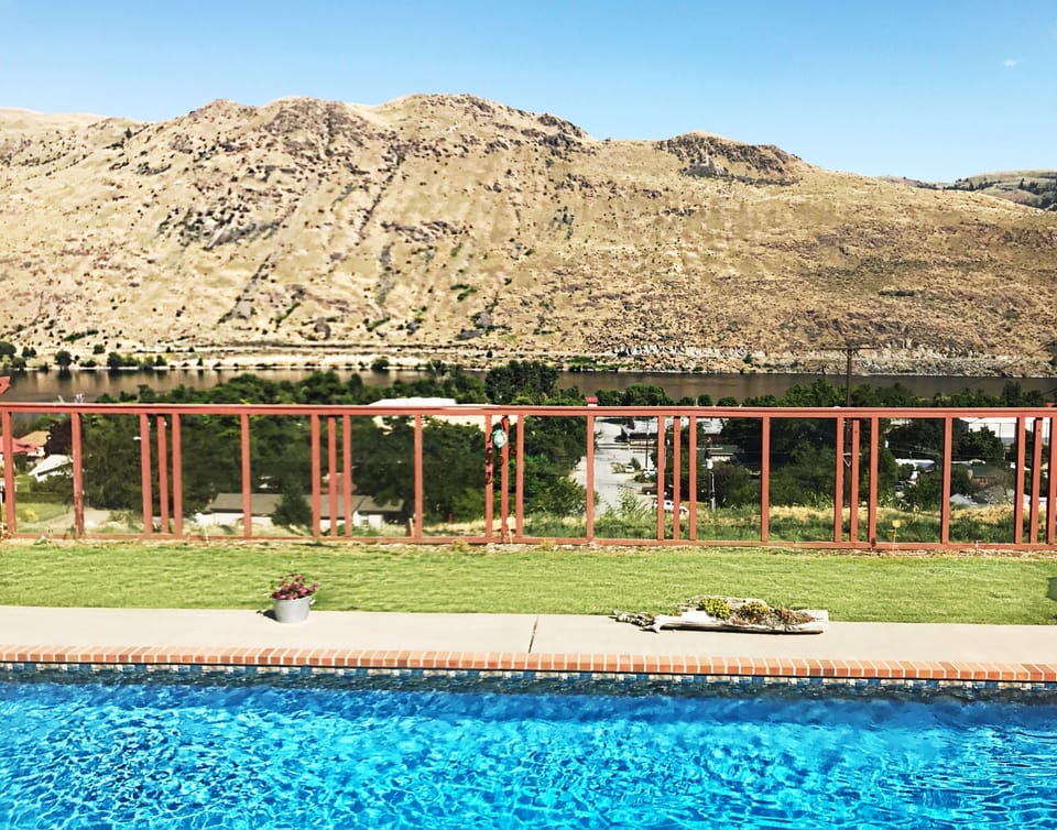 Glass fence allows views while you dip in the pool