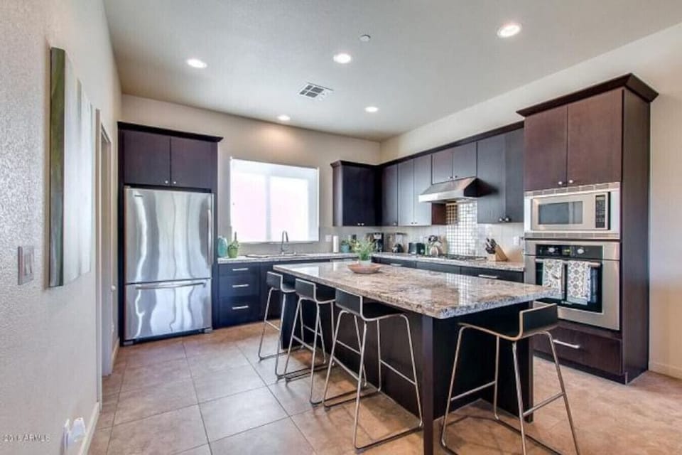 Updated Full Kitchen with Cookware and Large dining island.