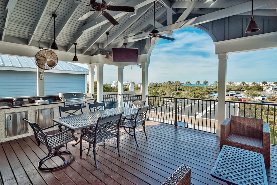 Upper Deck features a large screen TV, gas grill, gas cooktop, sink and frig