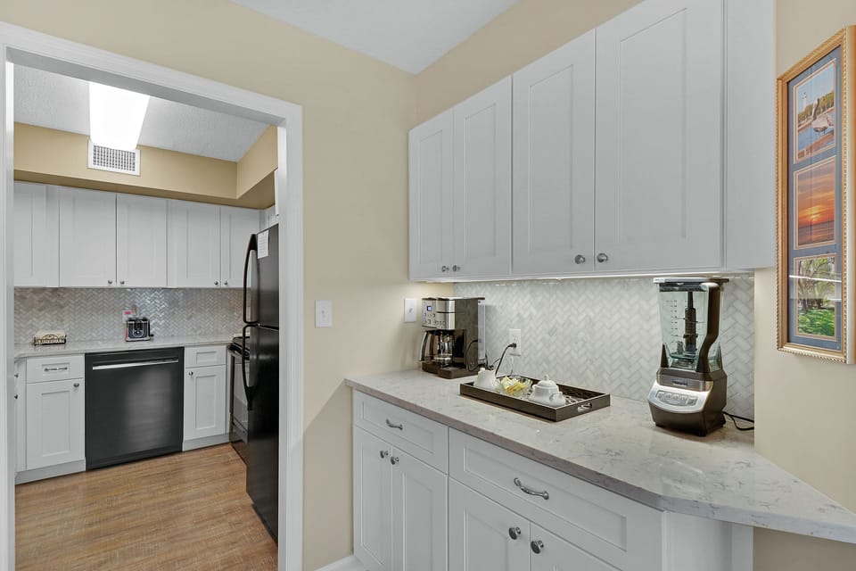 Coffee and Smoothie Station - Counter space, coffee maker, and blender sit between the kitchen and dining area.