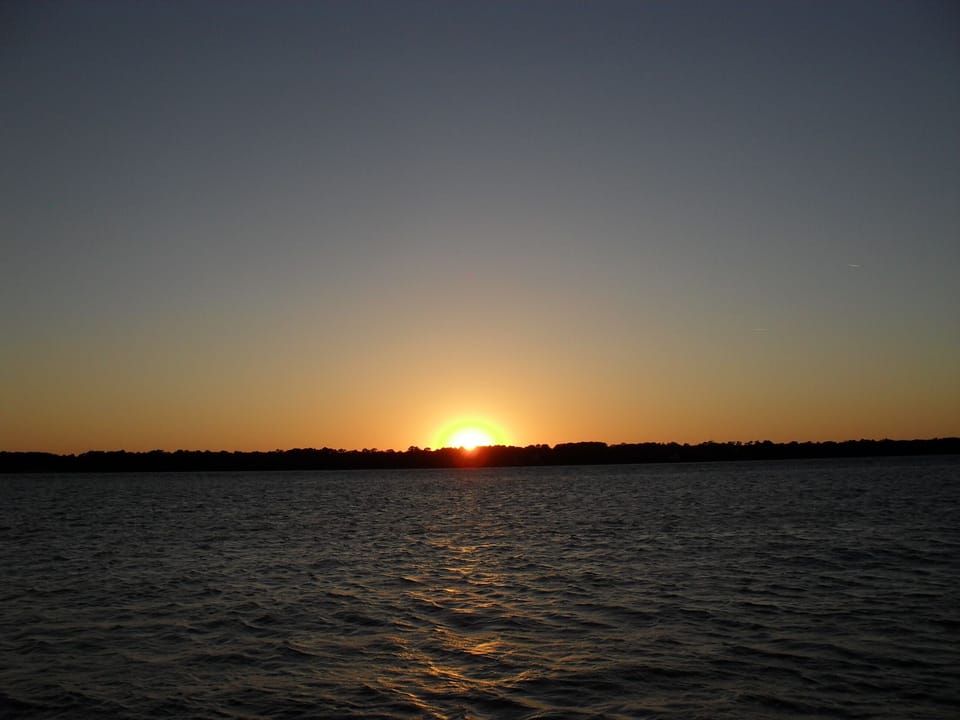 View of sunset over Dufuskie island from the beach