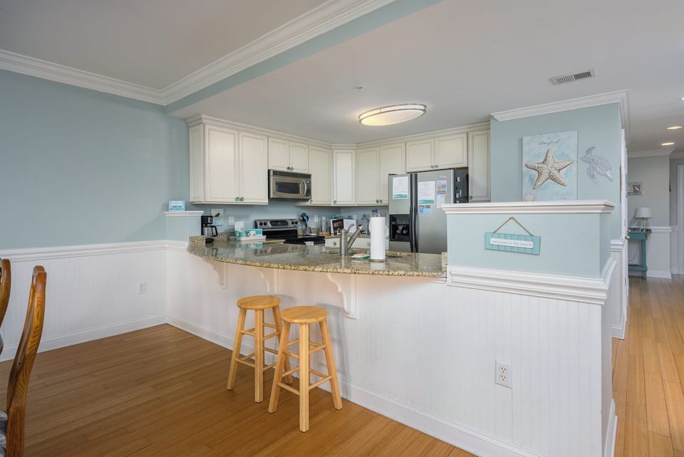 Barstools at kitchen counter.