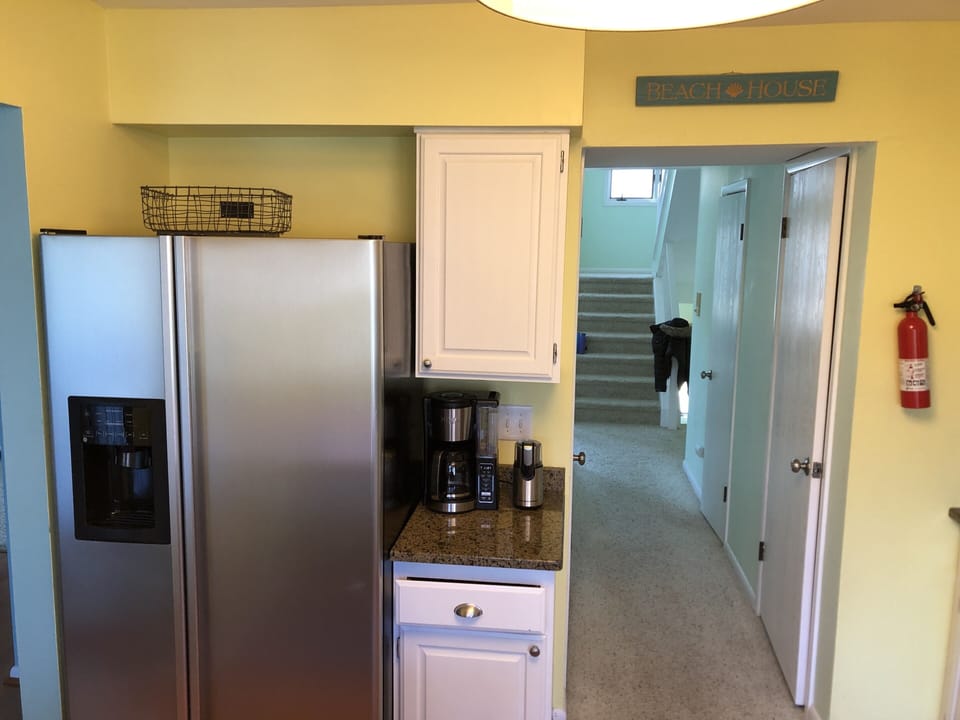 Spacious refrigerator with in-door filtered water and ice dispenser 