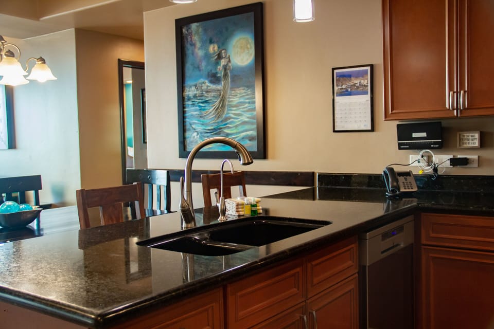 Dining room wall features commissioned painting by local artist, Memuco.