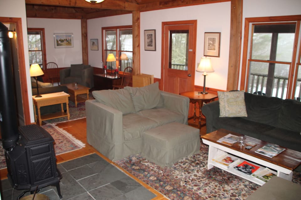 The main floor living area has plenty of seating, and great views off the deck
