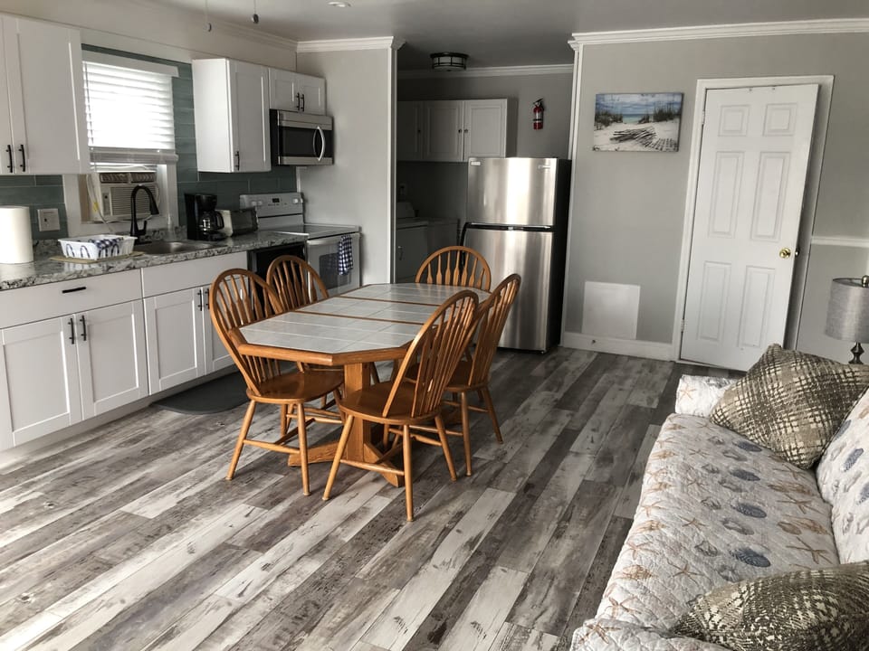 Beautiful vinyl flooring in living room and kitchen.