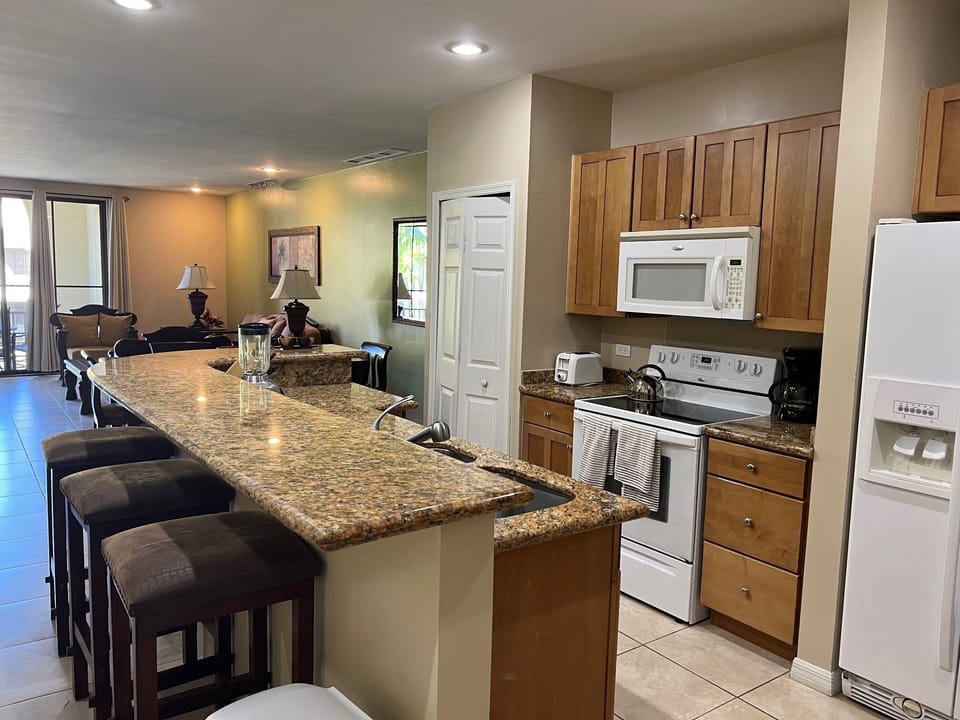 Kitchen island, new dishwasher+ fully equipped kitchen, and laundry room