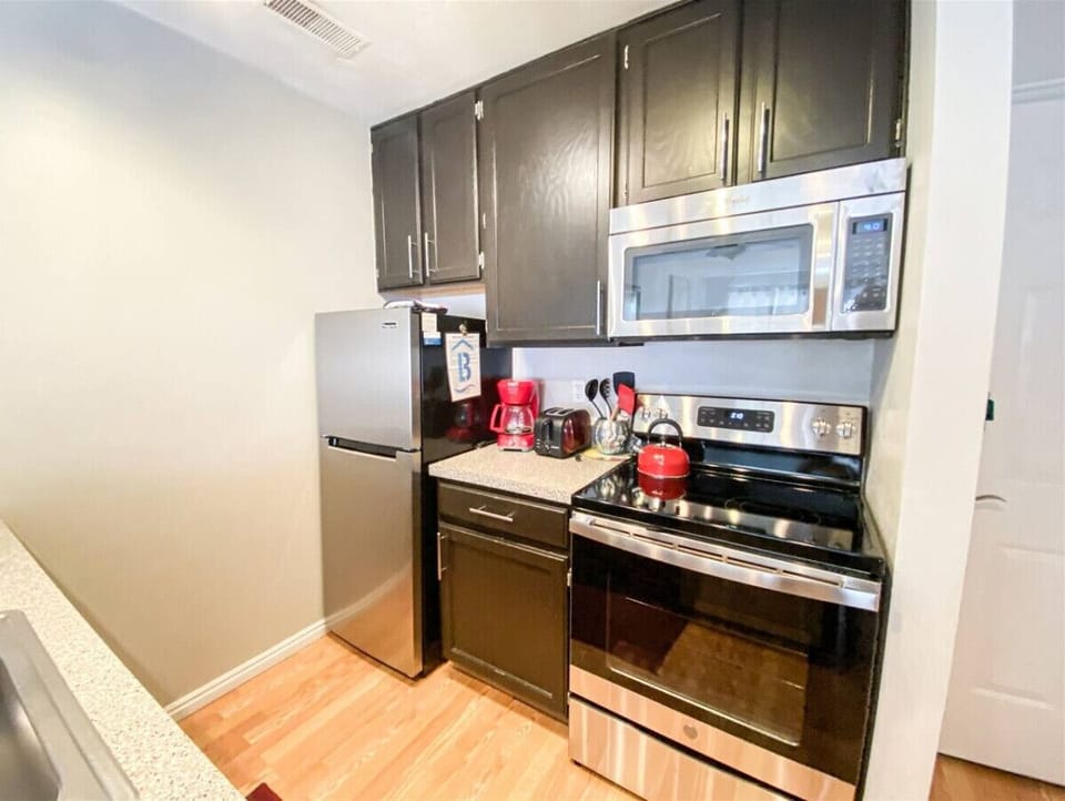 Modern kitchen with stainless appliances and ample counter space