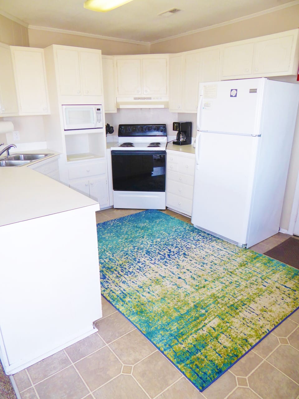 Kitchen has brand new cabinets! Cook while looking over the ocean -- or eat out!