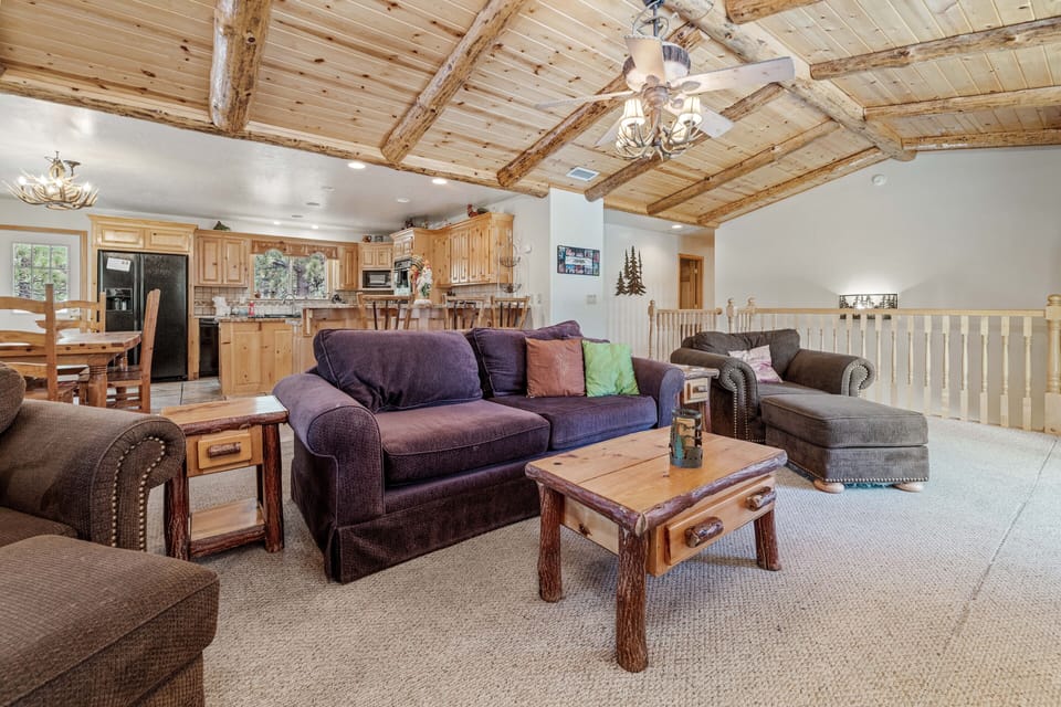 Spacious Living Room - Living room with indoor fireplace and TV.