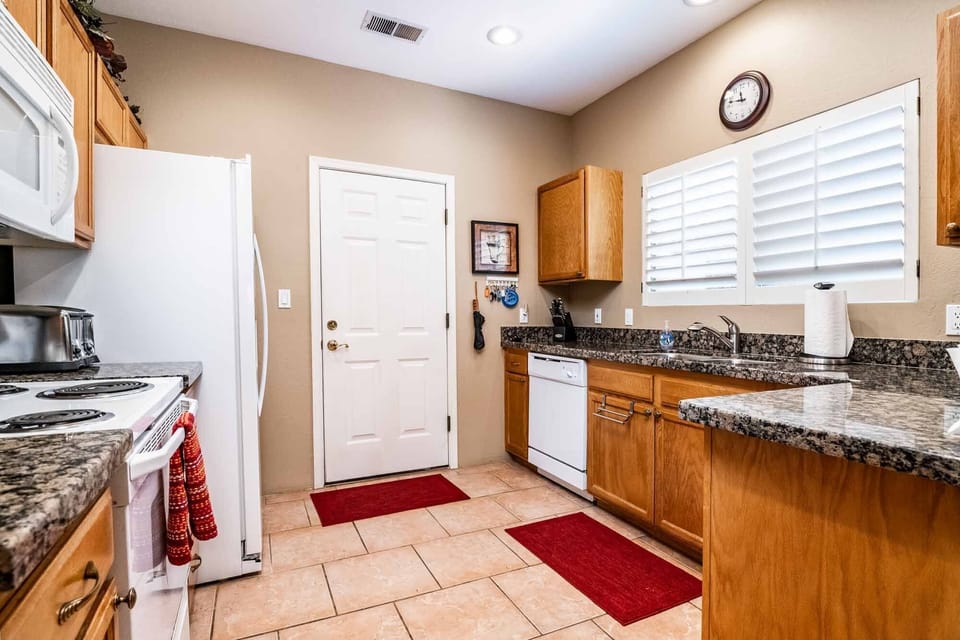 Kitchen w/ door leading into garage