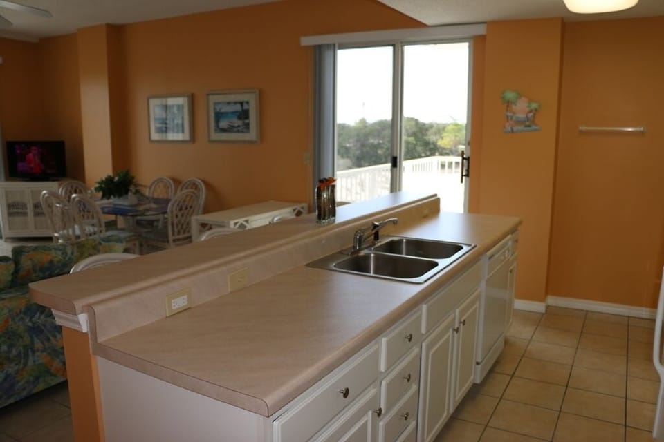 Dunes 209 - The kitchen with the sliding glass door to the second balcony.