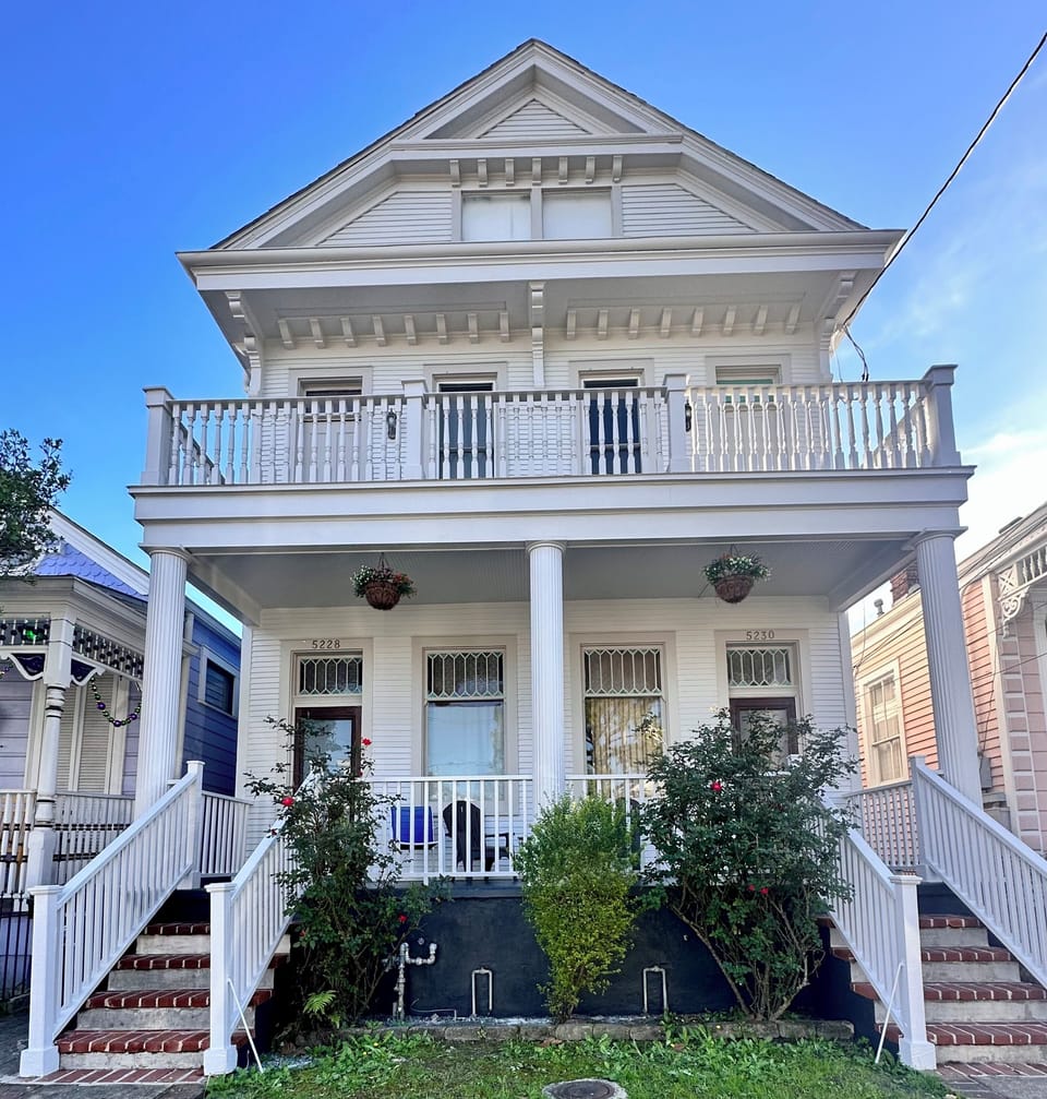Front of house. Main entrance on right.