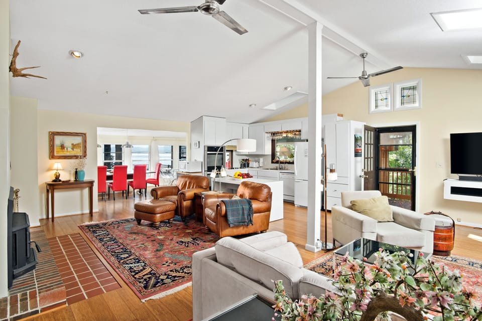View of the open living area into the kitchen area and into the dining area