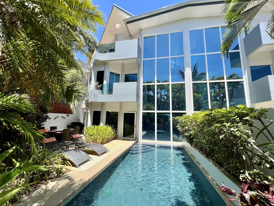 Backyard pool and house view. 